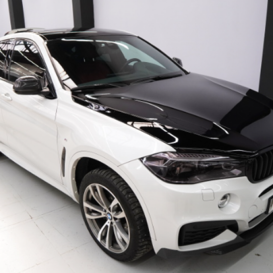 Оклейка крыши и капота BMW X6 в Sunmax 38 Black Gloss Color PPF