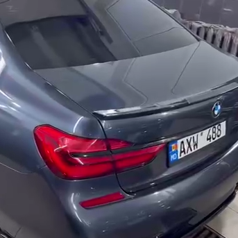 Оклейка крыши автомобиля BMW пленкой Sunmax 250 Gloss Black