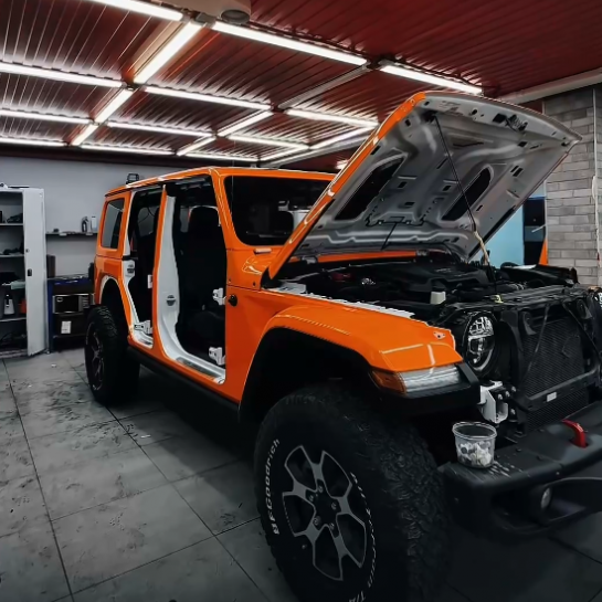Оклейка Jeep Wrangler защитным полиуретаном Sunmax 6 Lotus Orangе Color PPF 