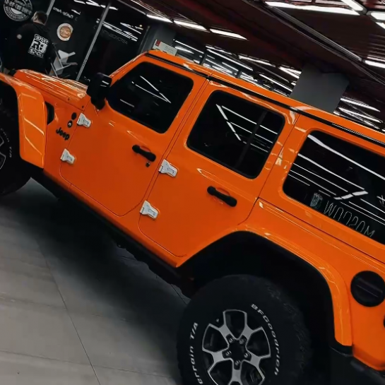Оклейка Jeep Wrangler защитным полиуретаном Sunmax 6 Lotus Orangе Color PPF 