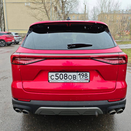 Оклейка кузова Chery Tiggo 8 профессионально полиуретаном Sunmax ярко-красного цвета