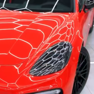 Оклейка Porsche полиуретаном Sunmax оттенка 1 Ferrari Red Gloss PPF 